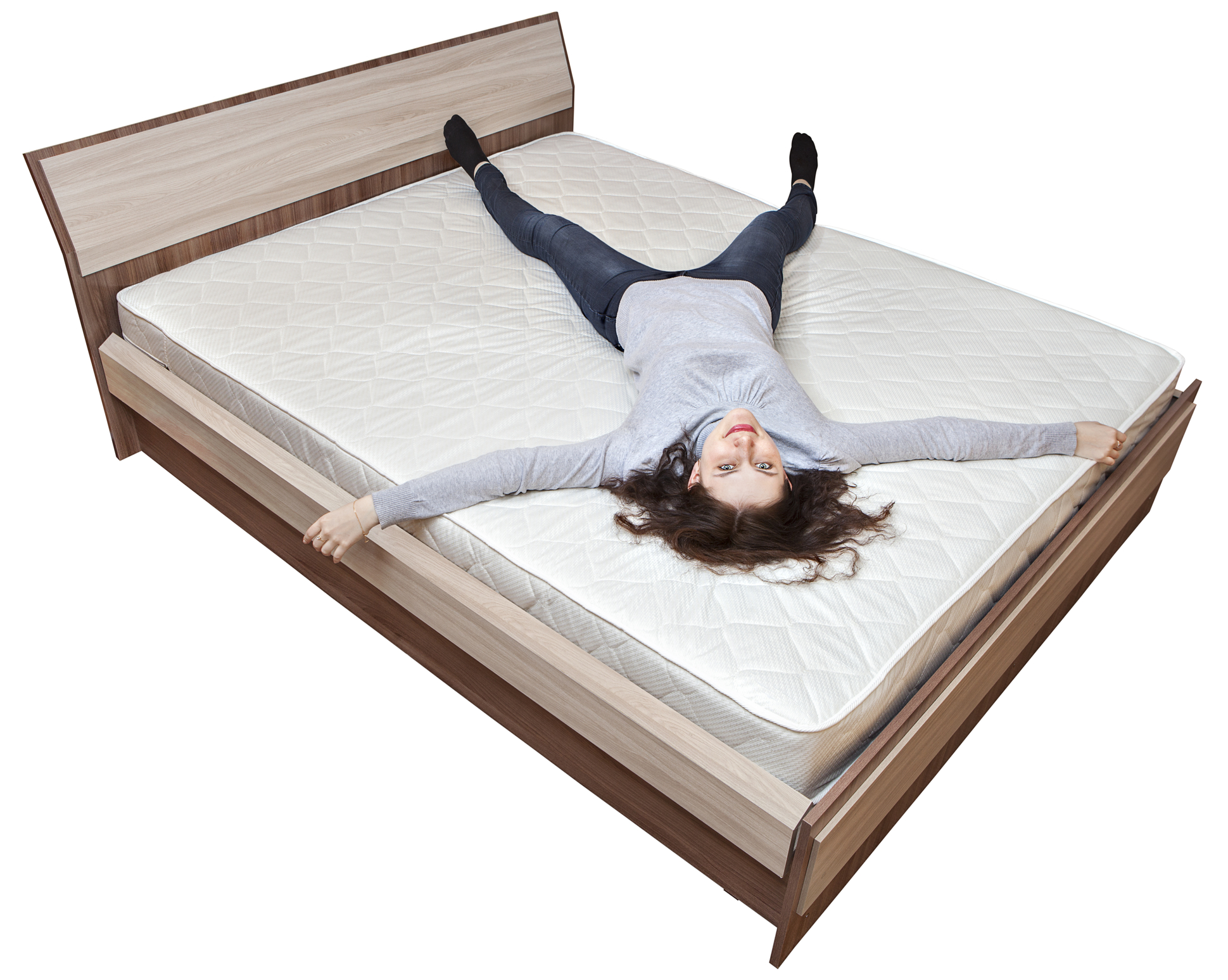 One young Caucasian girl is resting on bed innerspring mattress.