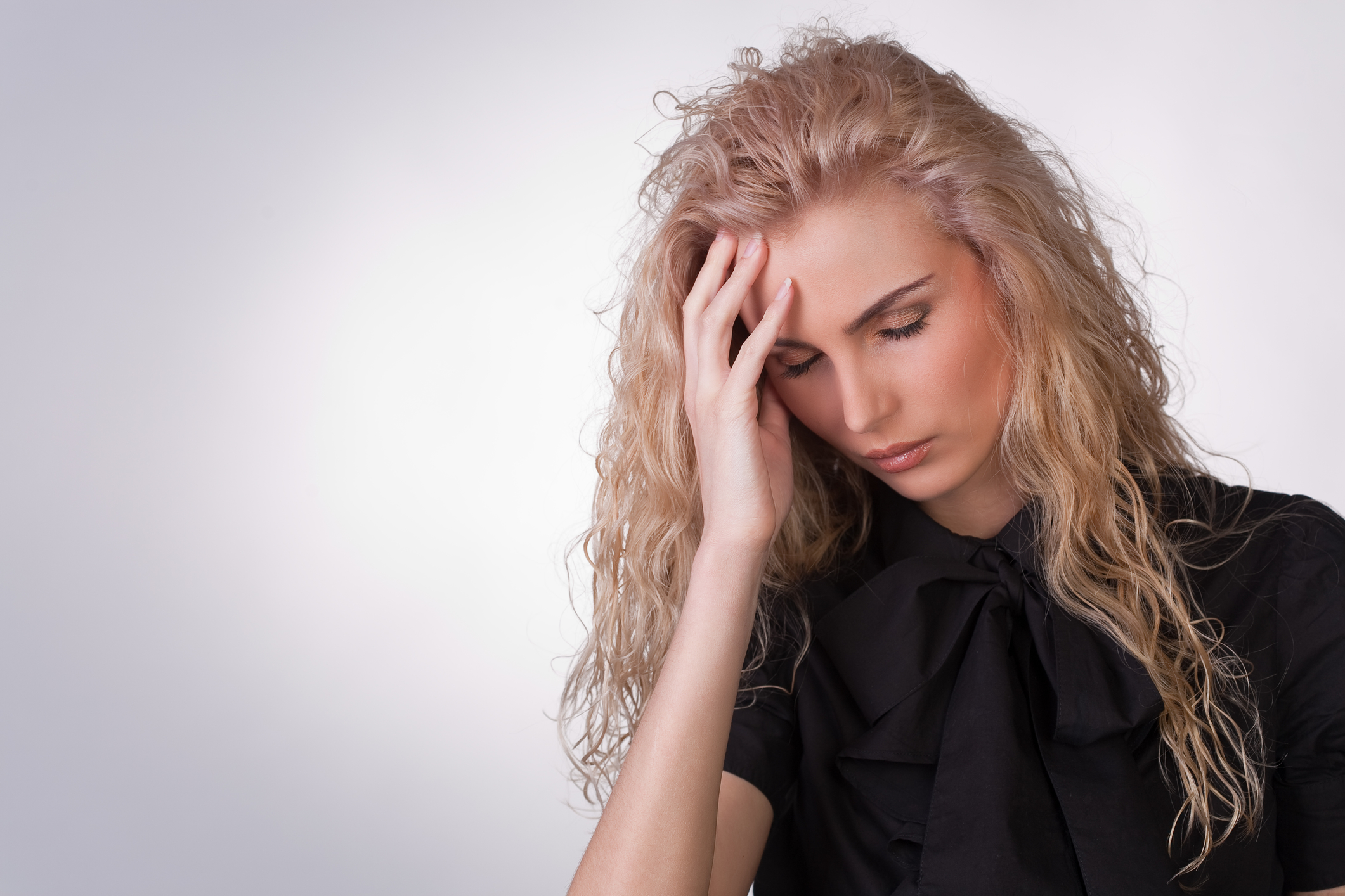 Woman with a migrane headache