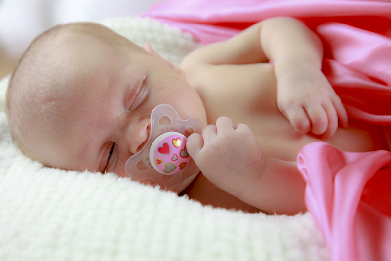 Sleeping baby with pacifier
