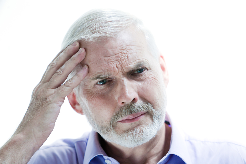 Migraine or memory loss illness senior man