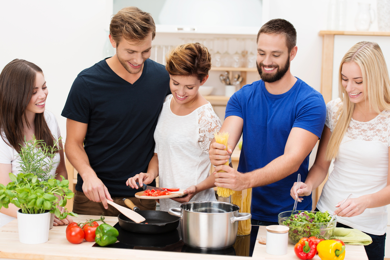 Group of friends preparing dinner