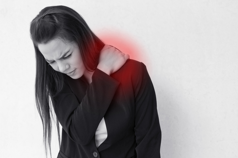 Heavy shoulder pain or stiffness of business woman
